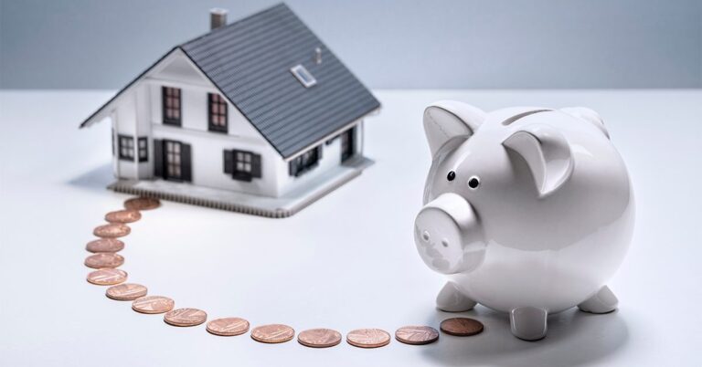 trail of pennies between a piggy bank and a toy house gettyimages 1344264025 1200w 628h