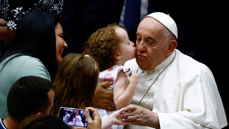 child kissing the pope